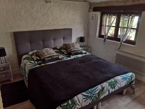 Postel nebo postele na pokoji v ubytování La Longère du Parc