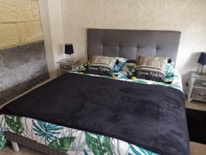 Postel nebo postele na pokoji v ubytování La Longère du Parc
