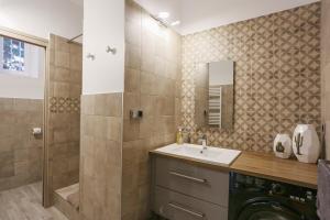 a bathroom with a sink and a shower at SunSet Cassis in Cassis +20 photos