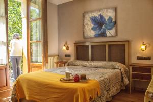 Ένα ή περισσότερα κρεβάτια σε δωμάτιο στο Hotel Valle del Silencio
