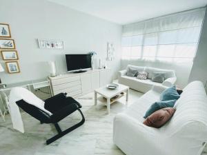 TV a/nebo společenská místnost v ubytování Santa Justa Sevilla Nervion Buhaira Centro