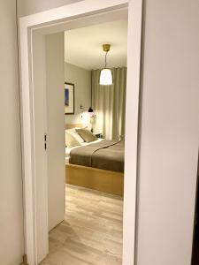 Postel nebo postele na pokoji v ubytování Apartamenty Park