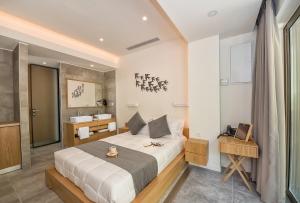 Postel nebo postele na pokoji v ubytování Lilium Luxury Suites