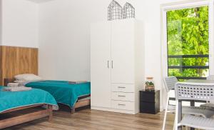 Tempat tidur dalam kamar di Noclegi CS17
