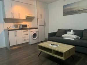 a living room with a couch and a table at Zerka Centro in Valencia +57 photos