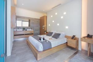 Postel nebo postele na pokoji v ubytování Lilium Luxury Suites