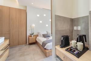 Postel nebo postele na pokoji v ubytování Lilium Luxury Suites