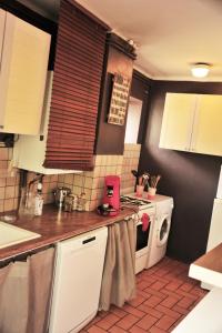 Η κουζίνα ή μικρή κουζίνα στο Logement au calme F2 +4 φωτογραφίες