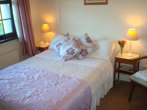 A bed or beds in a room at Athlumney Manor Guest Accommodation