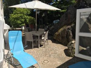 A patio or other outdoor area at caratteristica dependance in legno