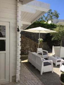 A patio or other outdoor area at caratteristica dependance in legno