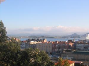 a view of a city and a body of water at ventanas a la bahia in Santander