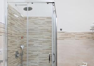 a shower with a glass door in a bathroom at Hotel Residence Nemo in Brindisi