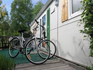 a bike parked on the side of a house at Holiday home Rozika in Slovenj Gradec