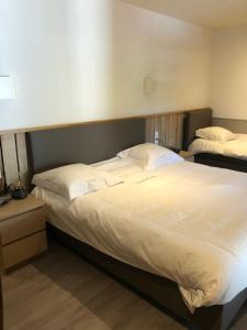Voodi või voodid majutusasutuse Hotel Val De La Cascade toas