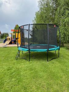 a trampoline on the grass in a park at YACHT CLUB WEJSUNY in Ruciane-Nida