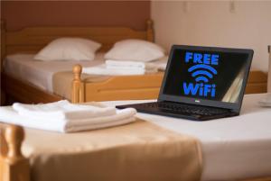 A bed or beds in a room at Atira Apartment Hotel