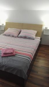 Postel nebo postele na pokoji v ubytování Tena Apartment