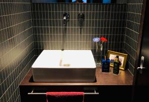 a bathroom with a white sink on a counter at Superbe chambre chez l'habitant in Saint Die