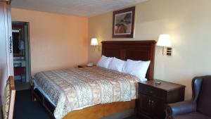 Ένα ή περισσότερα κρεβάτια σε δωμάτιο στο Garden Inn and Extended Stay