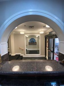 an archway leading into a room with a stage at Hotel 31 Extended Stay in New York