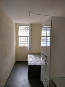a small room with a bed and a window at Morar Bem in Sao Paulo +77 photos