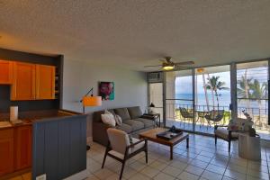 a living room with a couch and a table at Hale Kai O'Kihei 314 in Kihei