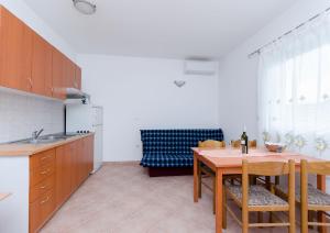 Kuchyňa alebo kuchynka v ubytovaní Apartments Alex