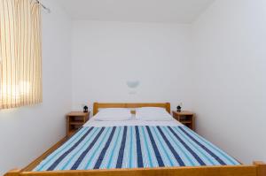 Posteľ alebo postele v izbe v ubytovaní Apartments Alex