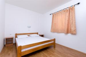 Posteľ alebo postele v izbe v ubytovaní Apartments Alex