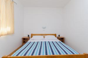 Posteľ alebo postele v izbe v ubytovaní Apartments Alex