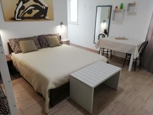 Ένα ή περισσότερα κρεβάτια σε δωμάτιο στο B&B DreAm Porto Cesareo