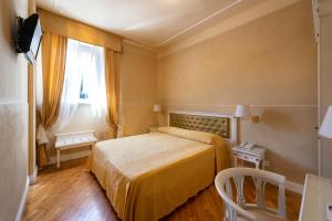 Letto o letti in una camera di Hotel Gennarino