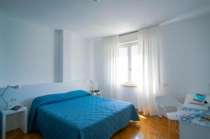 Posteľ alebo postele v izbe v ubytovaní Hotel Mistral
