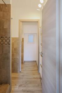 a hallway with a door leading to a bathroom at SunRise Cassis in Cassis +30 photos