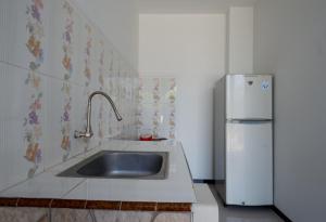 Kuchyň nebo kuchyňský kout v ubytování Villetta House Syariah
