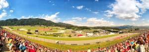 een grote menigte mensen die rond een renbaan staan bij GrandPrixCamp, closest to the Red Bull Ring, up to 4 guests in a tent in Spielberg