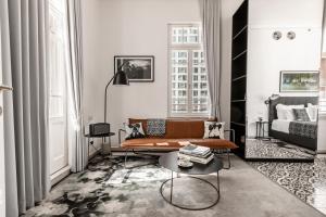 a living room with a couch and a table at Renoma in Tel Aviv
