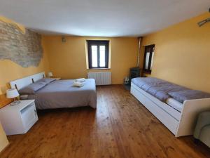 A bed or beds in a room at I Balzani B&B