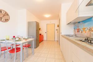 Kuchyňa alebo kuchynka v ubytovaní Appartamento Nautilus 2 - MyHo Casa