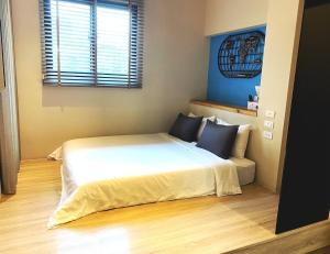 Voodi või voodid majutusasutuse Enjoy Homestay toas