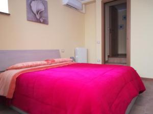 Postel nebo postele na pokoji v ubytování la corta di spello camere