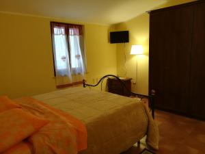 Postel nebo postele na pokoji v ubytování la corta di spello camere