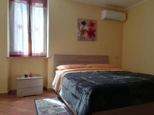 Postel nebo postele na pokoji v ubytování la corta di spello camere