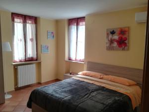 Postel nebo postele na pokoji v ubytování la corta di spello camere