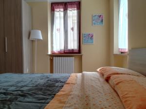 Postel nebo postele na pokoji v ubytování la corta di spello camere