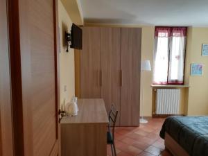 Postel nebo postele na pokoji v ubytování la corta di spello camere