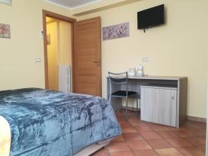 Postel nebo postele na pokoji v ubytování la corta di spello camere