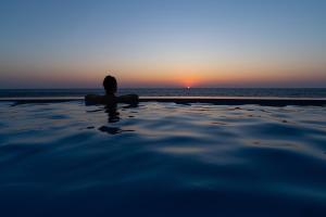 The sunrise or sunset as seen from the country house or nearby