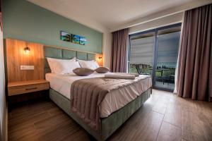 Postel nebo postele na pokoji v ubytování Calda Resort + 18 fotografií